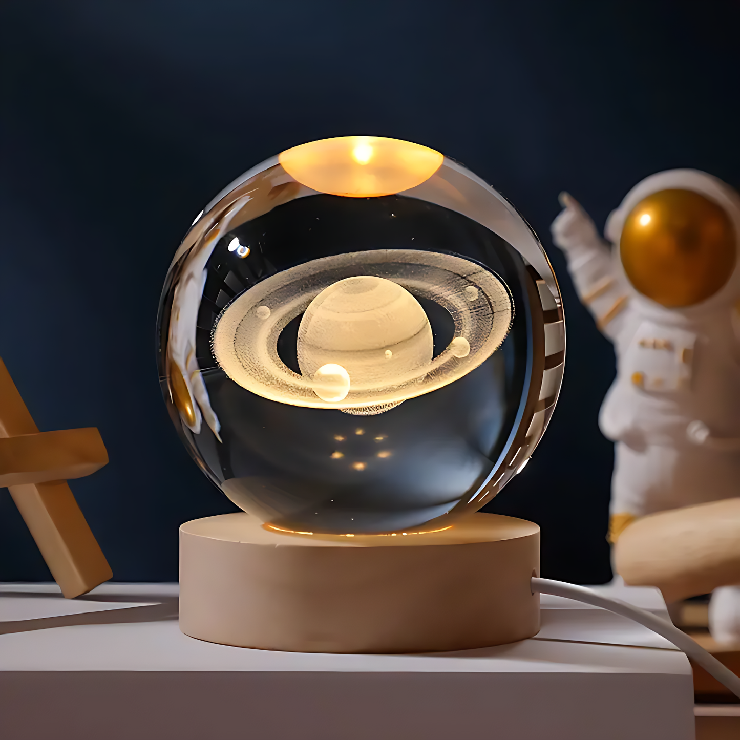 "Crystal ball with moon phase design glowing on dark stand"